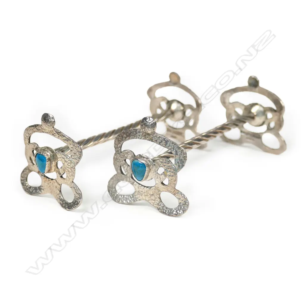 A pair of Reuben Watts N.Z. Arts & Crafts silver knife rests, Image 1++